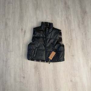 Thread Supply Reversible Faux Leather to Plaid Puffer Vest